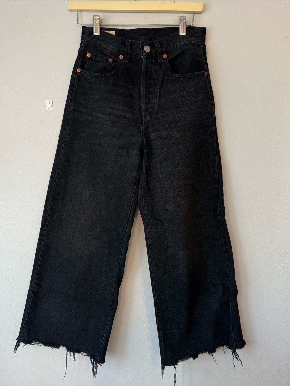 Levi's Black High-Rise Crop Flare Jeans with Raw Hem
